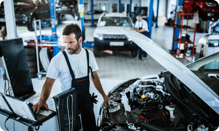 Car mechanic working through quality holds