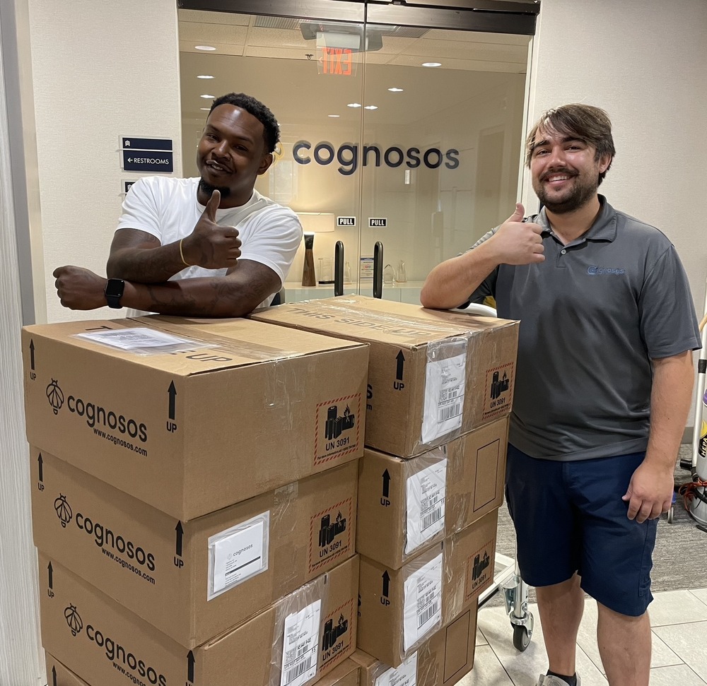 Cognosos team with shipping boxes