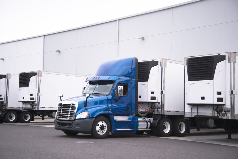 Reefer Truck and Trailers at Warehouse Dock