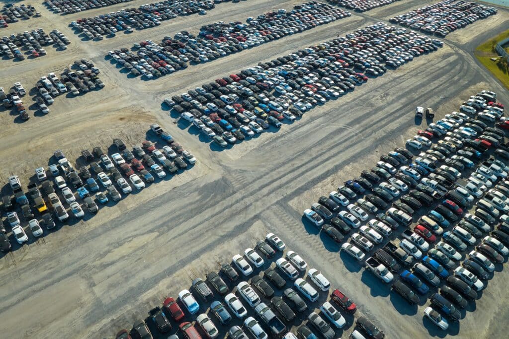 Aerial view of cars ready for auto auction, organized with real time location